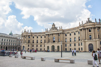 Group of people in front of historical building