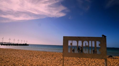 Scenic view of beach against clear sky