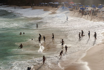 Large group of people on paciencia beach in the rio vermelho neighborhood of salvador, brazil. 