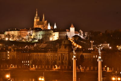 Illuminated buildings in city at night