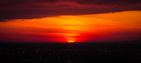 Scenic view of sunset over city