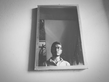 Portrait of boy on wall at home