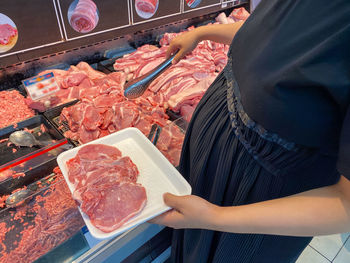 Midsection of person preparing food