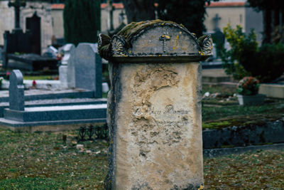 Close-up of stone structure in cemetery