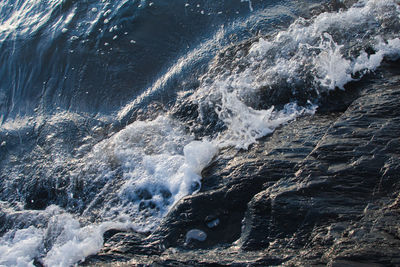 Sea waves splashing on rocks