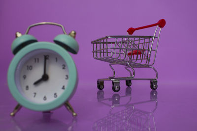 Close-up of clock in basket