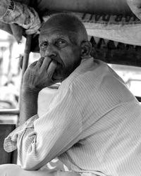 Portrait of man sitting outdoors