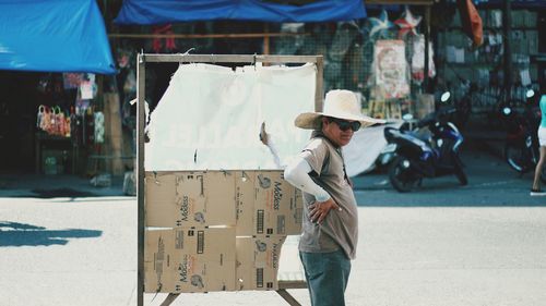 Full length of man standing on street in city