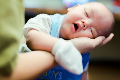 Close-up of cute newborn baby boy sleeping