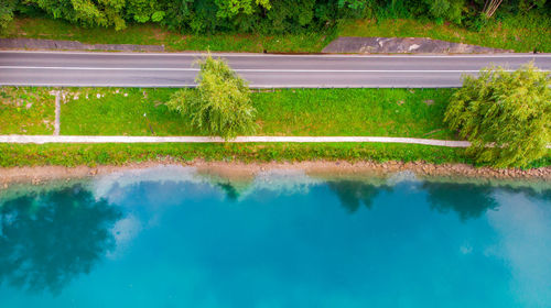 Reflection of trees and swimming pool in lake