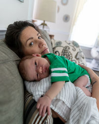 Cute baby lying on bed at home