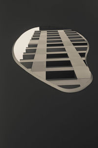 High angle view of illuminated lighting equipment against black background