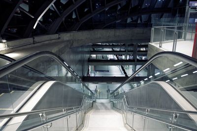 High angle view of man walking on escalator