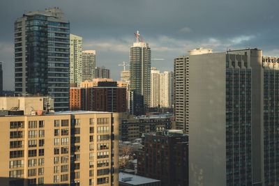 Buildings in city against sky