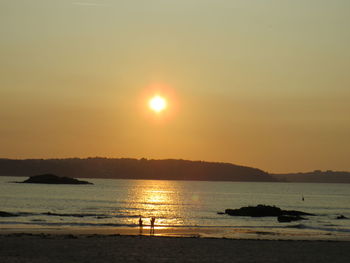 Scenic view of sea at sunset