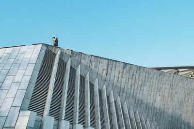 Low angle view of modern building against clear sky