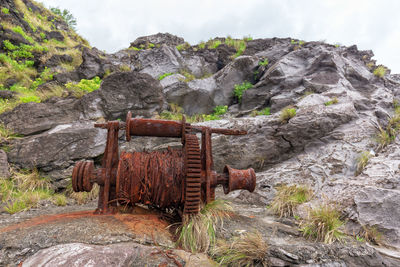 Rusty metallic structure on rocks