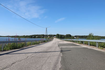 Empty road against sky