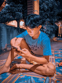 Young man looking at mobile phone