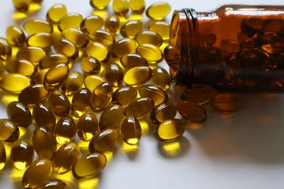 Close-up of yellow glass on table