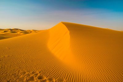 Scenic view of desert against sky