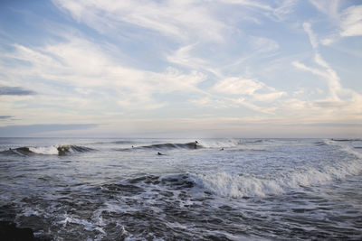 Scenic view of sea against cloudy sky