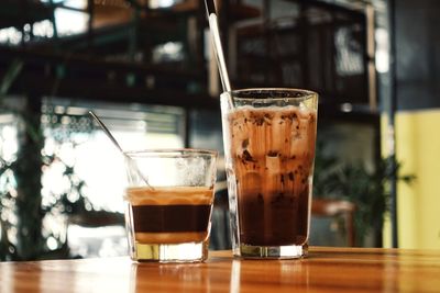 Close-up of coffee in glass on table