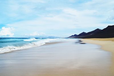 Scenic view of beach against sky