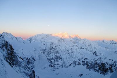 Scenic view of mountains against sky during winter