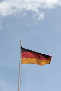 Low angle view of flag against sky