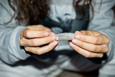 Close-up of woman holding hands