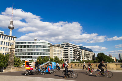 Man riding bicycle on city street