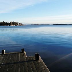 Pier over lake against sky