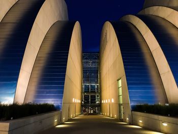 Low angle view of illuminated modern buildings in city at night