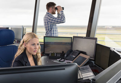 Female dispatcher working near colleague