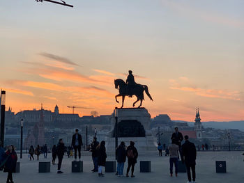 Silhouette of statue at sunset