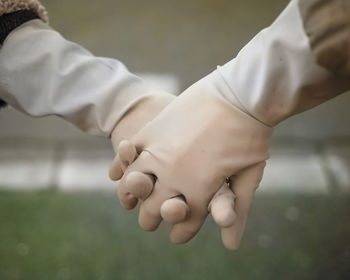 Close-up of man holding hands