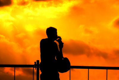 Silhouette of people at sunset