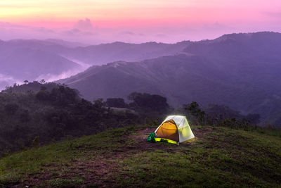 High angle view of tent on mountains against sky during sunset