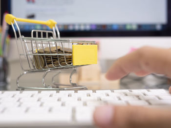 Close-up of person using smart phone at store