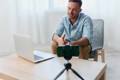 Portrait of doctor working on table