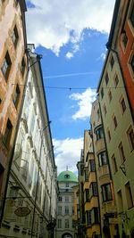 Low angle view of buildings in city against sky