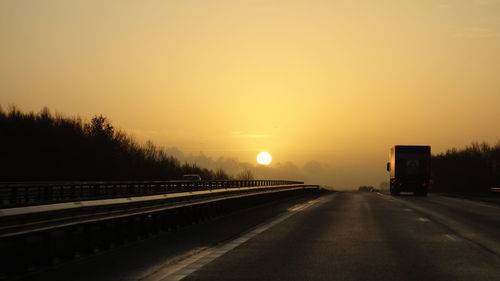 Road against sky during sunset