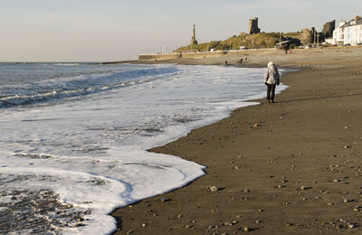 Man walking on beach