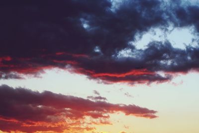 Low angle view of dramatic sky during sunset