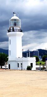 Lighthouse against overcast sky