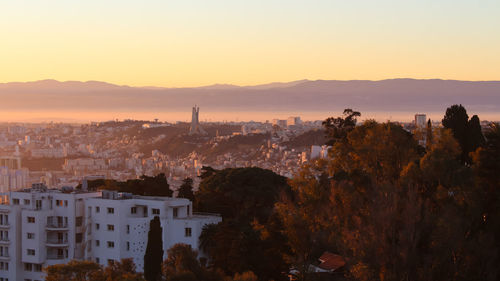 High angle view of townscape against sky during sunset