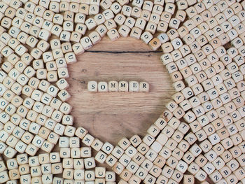 High angle view of alphabets on blocks at wooden table