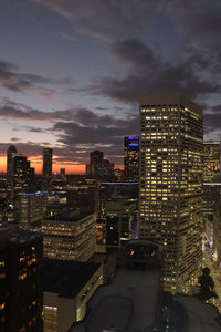 High angle view of illuminated buildings in city at night