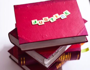 Close-up of text on table against white background